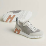 HERMES BOUNCING SNEAKER GREY WITH ORANGE LOGO – authentiek designer item, direct leverbaar bij Mivelia